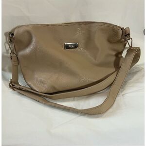 BCBG tan crossbody bag with zipper closure and adjustable strap